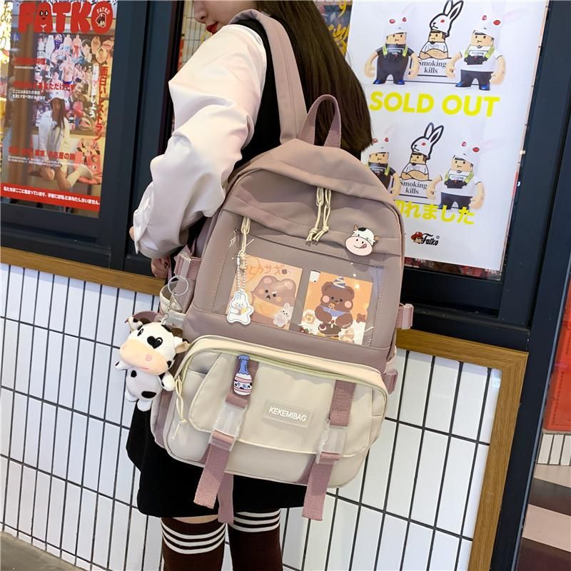 Ins schoolbag female cute girl Korean version of Harajuku ulzzang junior high school students fourth, fifth and sixth grade backpack Pink pendant with badge