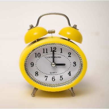 Round Faced Yellow Alarm Clock With Double Bells