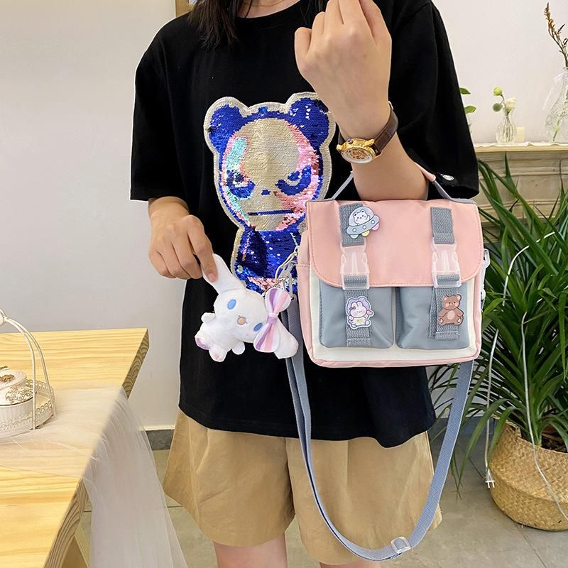 Early autumn new small bag Japanese cute student hand shoulder bag Mori girl soft girl style bag cover Messenger bag pink + pendant
