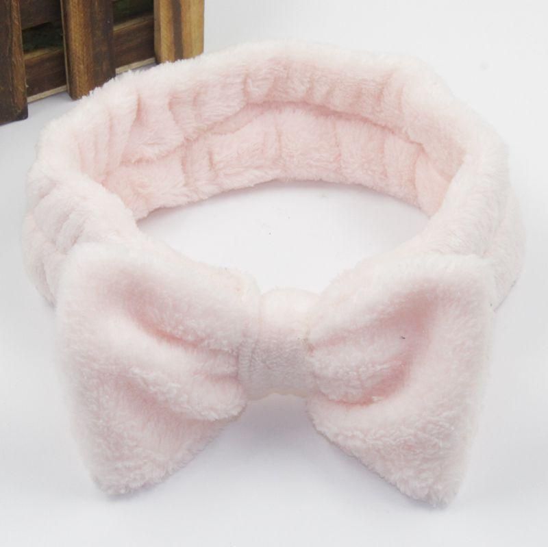 European and American coral fleece bow headband ladies wide-brimmed wash solid color headband flannel headband fashion headwear tooth pink