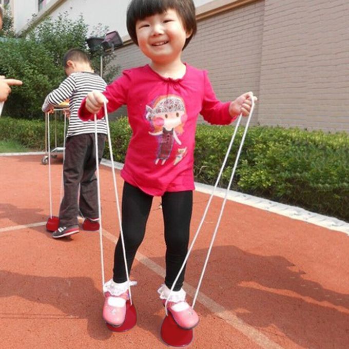 Children Kids Outdoor Fun Walk Stilt Jump Smile Face Balance Training Toy