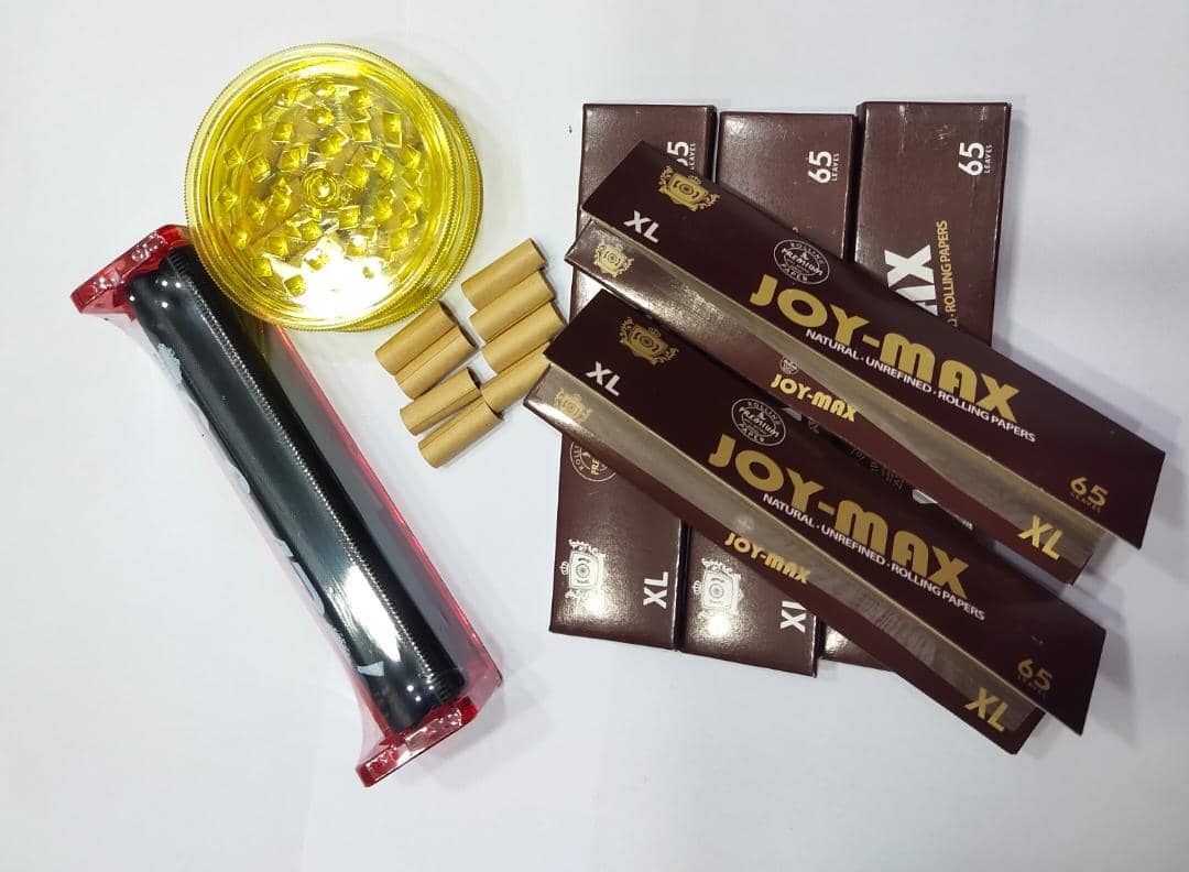 Tobacco Crusher (Green) + Weed Roller (Transparent) + 5 Booklets Of Brown Rolling Smoking Papers