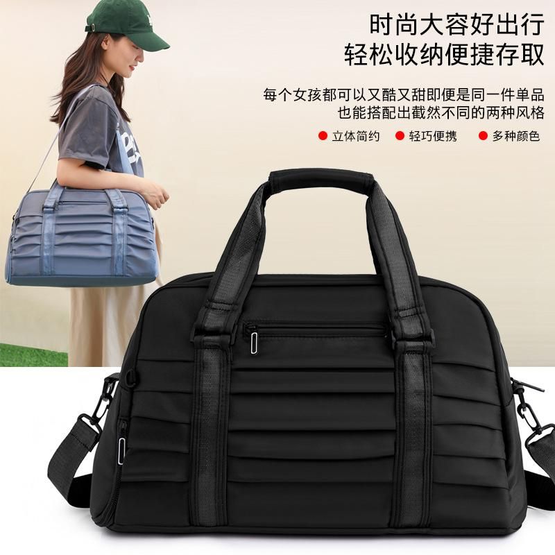 New pleated hand luggage bag large capacity short-distance travel bag wet and dry separation fitness bag swimming bag women's bag Pink
