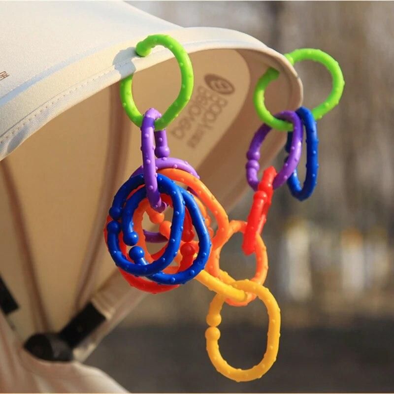 24pcs/lot New Rainbow Ring Rodent Baby 24 Months Teether Car Hanging Kids Bed Hanging Card Teethers Toys For Children